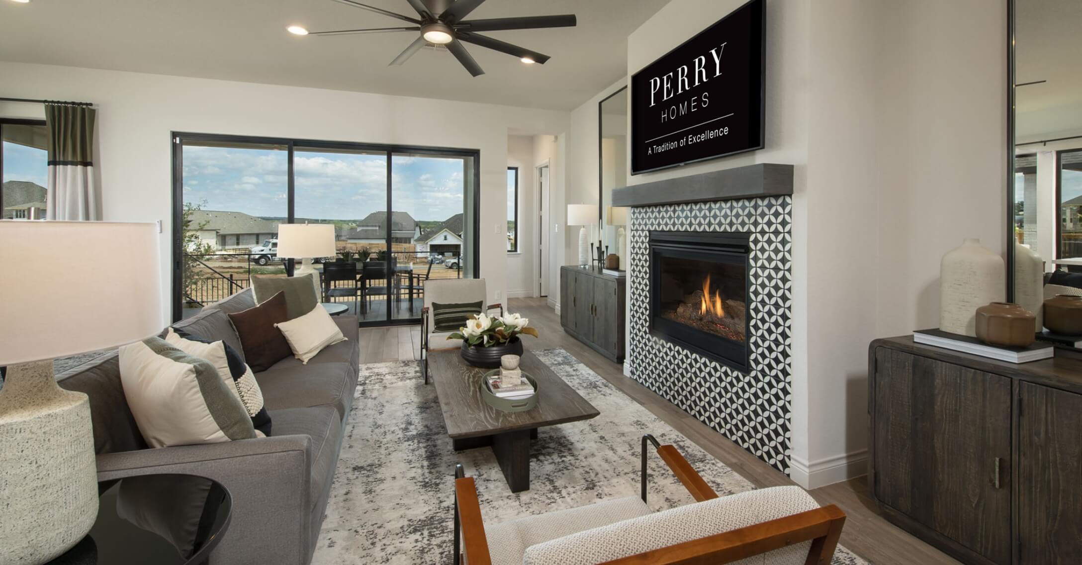 A cozy living room featuring a fireplace and TV, located in New Braunfels.