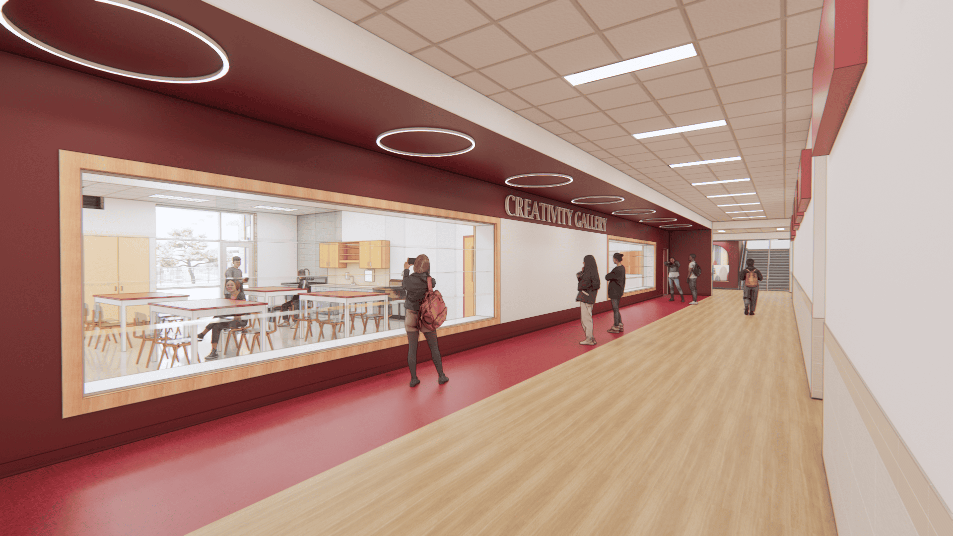 Major Middle School hallway with wood flooring and red accents features a large window into a classroom labeled "Creativity Center," where students are visible. Several people walk and stand in the hallway.