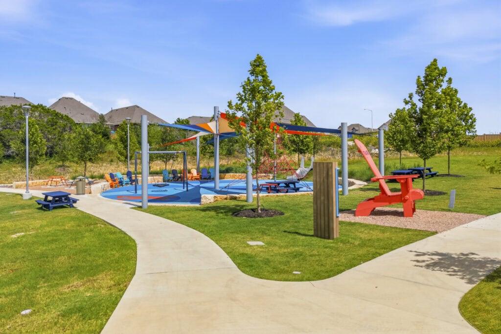Fairway Park in Mayfair showing beautiful outdoor amenities including trails, a playground with a colorful shade covering